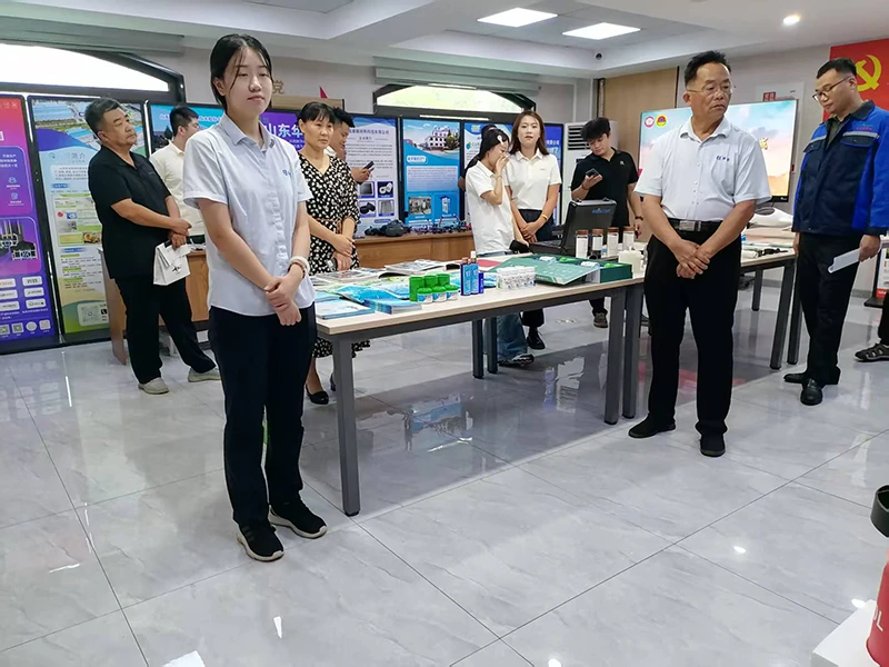 Ms. Sun is explaining to the exhibitors